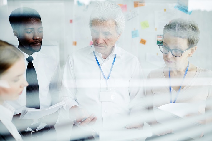Team of successful investigators discussing new crime in office